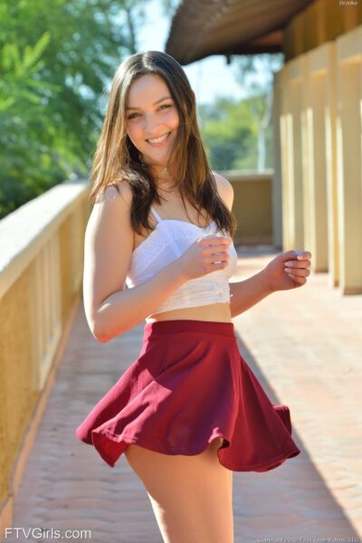 Adorable brunette teen Brooke reveals her cute boobs and twat in public Image #16