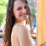 Amateur cutie Liz gets rid of her shirt and panties in public and poses