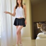 Amateur Lily upskirting in public & posing with her pets before getting naked