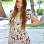 Amateur model Myra strips to her high heeled shoes in a public lot