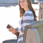 Bosomy babe Summer exposes her big ass while playing a small guitar in public
