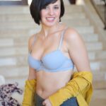 Busty amateur doll Zeba poses before fucking a cucumber on the stairs