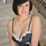 Busty amateur doll Zeba poses before fucking a cucumber on the stairs