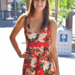 Cute teen Ellie hikes up her dress to masturbate on a public veranda