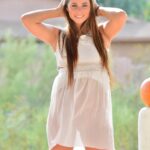 Glamour babe in a see-through dress Aveline flashing an upskirt in public