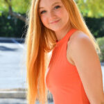 Natural redhead Sierra gets totally naked on a winding staircase
