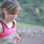 Naughty amateur Sadie works out while naked after showing her tits in public
