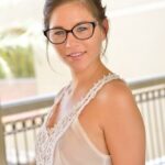 Nerdy teen girl hikes her miniskirt and proceeds to fist her pussy