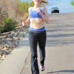 Skinny blonde Emilee exposes her tits while jogging and gets naked at home