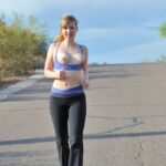 Skinny blonde Emilee exposes her tits while jogging and gets naked at home