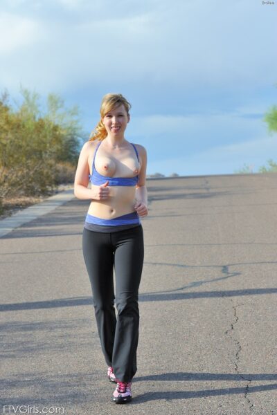 Skinny blonde Emilee exposes her tits while jogging and gets naked at home Image #6