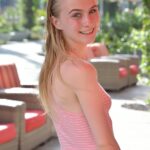 Slim 18 year old Sharlotte flashes her naked pussy in public places