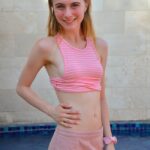 Slim 18 year old Sharlotte flashes her naked pussy in public places
