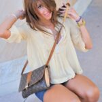 Slim teen in heels Melina doffs her denim skirt and poses naked in public