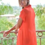 Solo girl slips off her long and quite see thru shirt out on the balcony