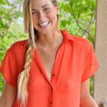 Solo girl slips off her long and quite see thru shirt out on the balcony