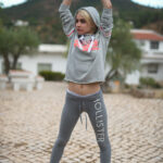 Tiny blonde teen Chloe works out in a hoodie & shows her small tits in public