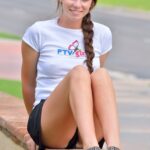 Adorable brunette Aveline flashes her cunt in public and stretches it on a bed