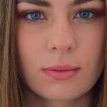 Adorable teen with small boobs Carmen doffs her red dress and flaunts her body