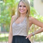 Cute blonde girl in black thong posing for sexy upskirt on the street