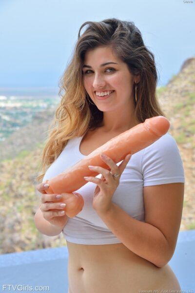 Cute teen girl inserts a huge dildo into her pussy before self fisting Image #13