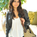 Sexy brunette Eliana stands naked during a solo engagement