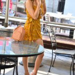 Amateur babe Penelope lifts her dress up and grabs her hot ass in public