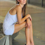Beautiful female with great legs heads outdoors for public exhibitionism