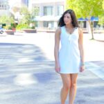 Black haired babe Madeline doffs her white dress to expose her arousing body