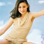Brunette honey Mia exposes her shaved cunt and spreads it wide on the stairs