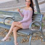 Sensual brunette Olivia hikes her dress up and toys her anal hole in public