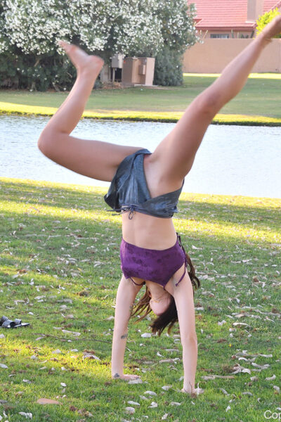 Amateur girl April does a handstand in a public park while barefoot Image #2