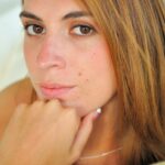 Flawless beauty Thena undresses to show off her small compact ass