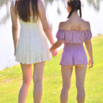 Horny tall babe Mira & her petite friend Olivia strip & pose naked outdoors