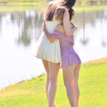 Horny tall babe Mira & her petite friend Olivia strip & pose naked outdoors