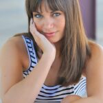 Adorable brunette Cory rolls her skirt up and plays with a cucumber outdoors
