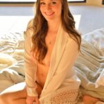 Breathtaking brunette Summer bares her natural juggs and trimmed pussy