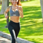 Hot babe Charlotte reveals her big juggs and petite figure while exercising