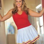 Lovely cheerleader Pamela fingers & toys her sweet shaved pussy
