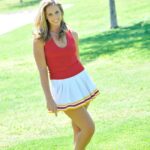 Lovely cheerleader Pamela fingers & toys her sweet shaved pussy