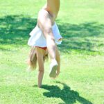 Lovely cheerleader Pamela fingers & toys her sweet shaved pussy