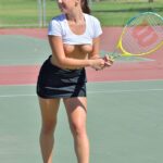 Amateur brunette Jenna flashes her tits & sticks a racquet handle in her twat