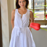 Brunette cutie Ariana rides a massive rubber dildo wearing a white dress