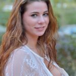 Cute teen Aveline reveals her asshole and pierced nipples in public transport