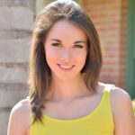 Gorgeous brunette teen strips out of her yellow dress in public