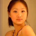 Gorgeous Chinese girl Tia flashing an arousing pantyless upskirt