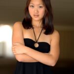 Gorgeous Chinese girl Tia flashing an arousing pantyless upskirt