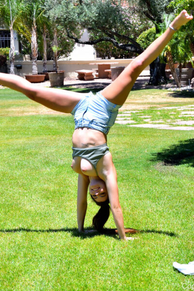 Big boobed amateur babe Scarlett strips naked in public while doing exercises Image #6