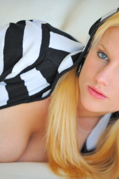 Blonde girl with big naturals takes a dildo to her pussy in a striped hoodie Image #6