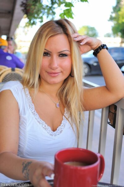 Busty amateur with big tits strips outdoors to fondle her pierced pussy Image #4